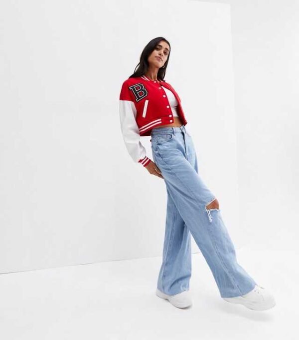 . Elevate your style with our Pink Vanilla Red Crop Varsity Bomber Jacket. Perfect for a trendy look, this jacket combines comfort and fashion effortlessly.