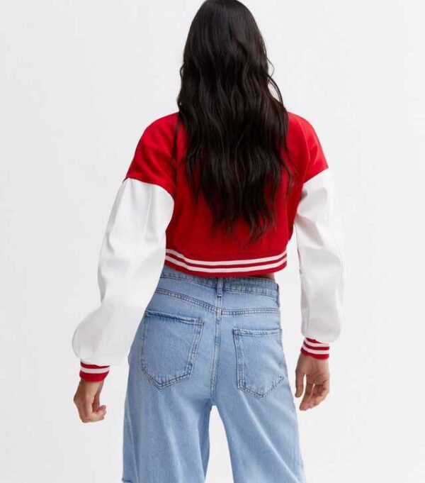 . Elevate your style with our Pink Vanilla Red Crop Varsity Bomber Jacket. Perfect for a trendy look, this jacket combines comfort and fashion effortlessly.