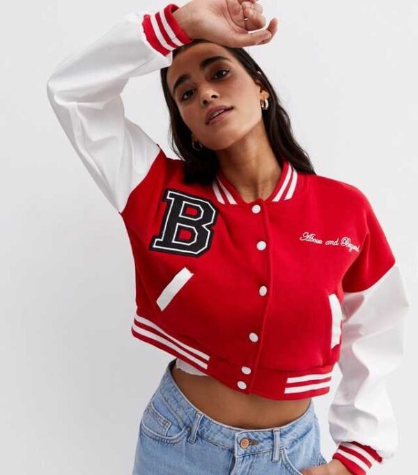 . Elevate your style with our Pink Vanilla Red Crop Varsity Bomber Jacket. Perfect for a trendy look, this jacket combines comfort and fashion effortlessly.